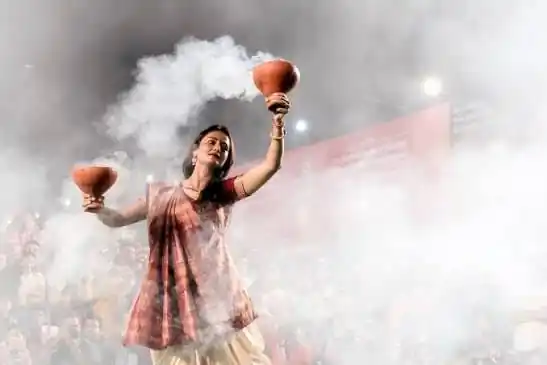 Dhunuchi dancer surrounded by incense smoke